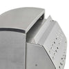 Close-up of a stainless steel grill's hood and rear corner with a perforated vent panel on white background