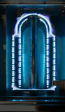 Lit U-shaped tube burner with bright blue flames showing even heat delivery inside an Alfresco built-in gas grill