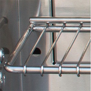 Close-up of the stainless steel warming rack inside an Alfresco built-in gas grill