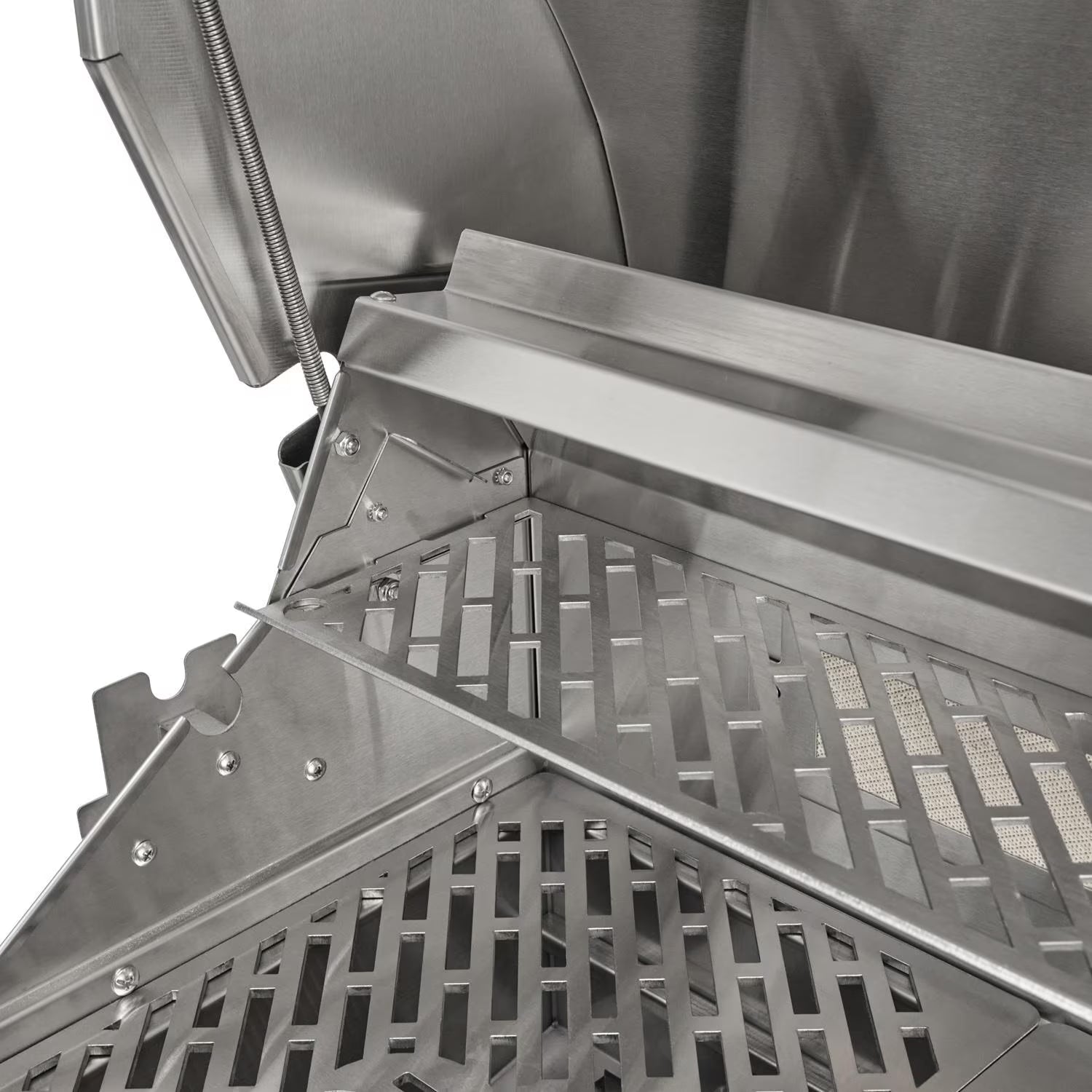 Close-up of a stainless steel grill with the lid open showing the hinge spring, warming rack, cooking grates and rear infrared burner mesh, on a white background