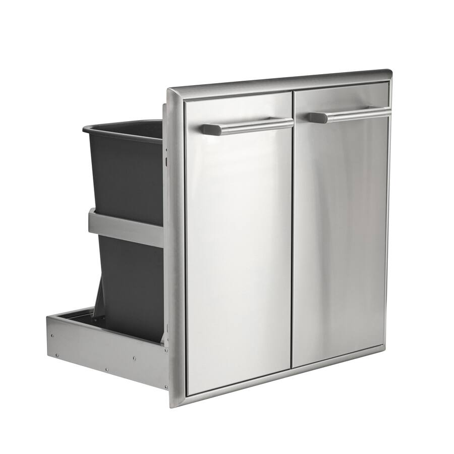 A stainless steel built-in outdoor double-door cabinet with a pull-out dual trash and recycle bin drawer holding two black liner bins, shown at an angle with the drawer extended, against a white background