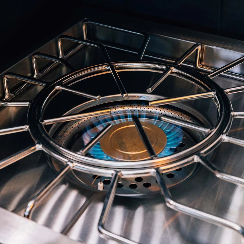 Atlas Power Burner inner ring lit with a blue simmer flame at 24,000 BTU
