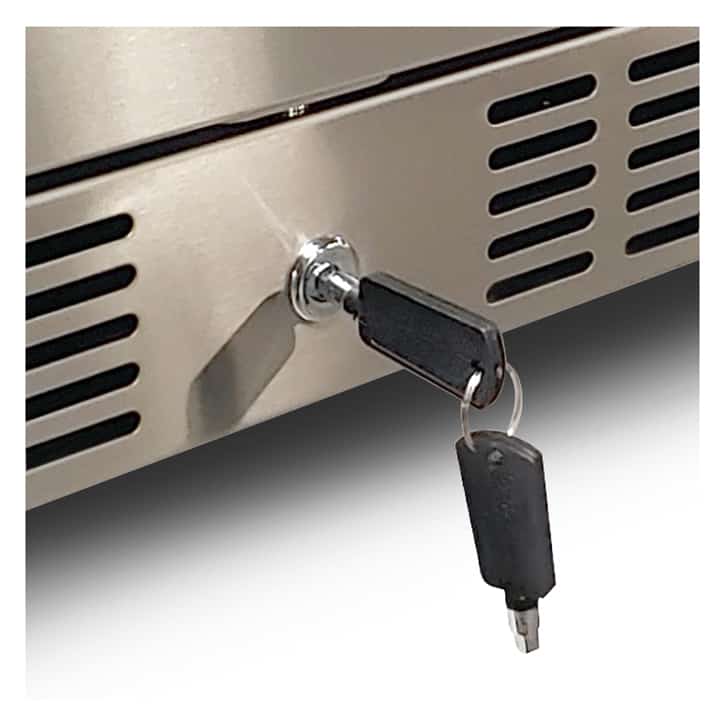 Close-up of the keyed lock on an Artisan stainless steel outdoor refrigerator with the key inserted