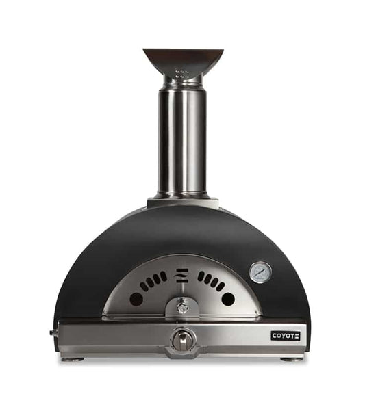 A Coyote outdoor pizza oven with a matte black domed body and a stainless steel chimney, an arched front cooking opening, a round temperature gauge, and the Coyote logo on the stainless front base, shown front-on against a white background