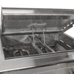 A close-up detail thumbnail showing the stainless steel interior firebox and burner area of a built-in gas grill