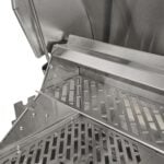 A close-up feature thumbnail showing the stainless steel warming rack holder bracket inside a built-in gas grill, supporting the perforated warming rack