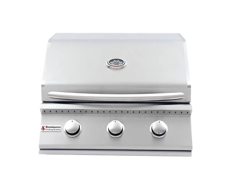 Front view of an RCS Premier 26-inch three-burner built-in gas grill with its dual-lined stainless steel hood closed, showing the temperature gauge, handle, three control knobs and the Renaissance Cooking Systems logo, on a white background