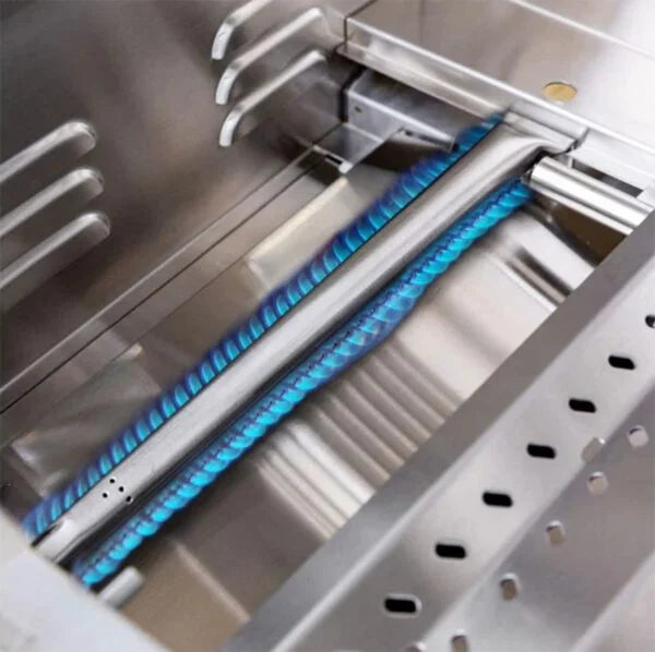 Close-up of a Summerset Sizzler 32-inch grill interior with a lit stainless steel tube burner showing blue flames and the warming rack