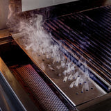 TrueFlame stainless steel smoker box producing smoke on grill cooking grates