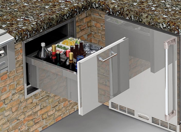 Alfresco 26-inch under-counter ice drawer and beverage center pulled open in an outdoor kitchen island, AXE-ID