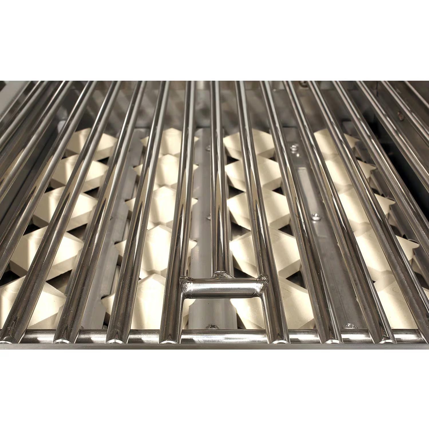 Close-up of the stainless steel cooking grates and ceramic briquettes inside an Alfresco built-in gas grill, on white background