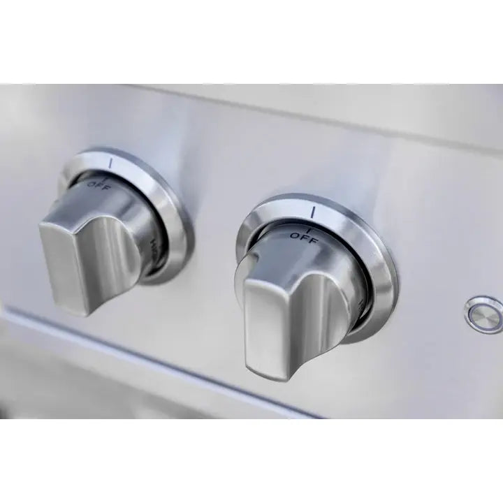 Close-up of two stainless steel AMG Atlas double side burner control knobs set to OFF