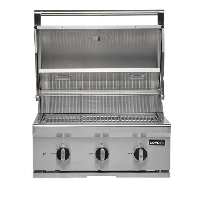 A stainless steel Coyote 30-inch C-Series built-in gas grill shown front-on with the lid fully open, revealing the cooking grates and a warming rack inside, three control knobs on the front, and the Coyote logo, against a white background