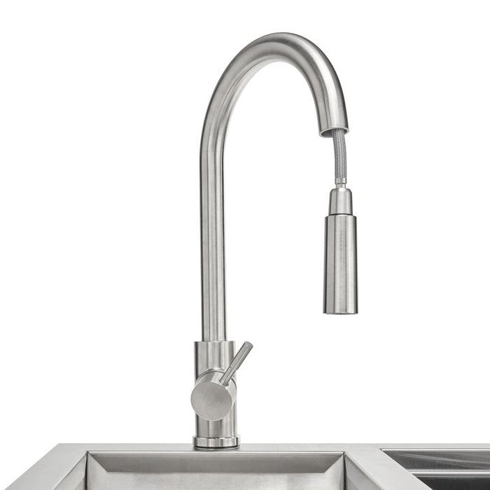 A close-up of the stainless steel gooseneck pull-down faucet and sink basin on the Coyote 30-inch refreshment center, shown against a white background