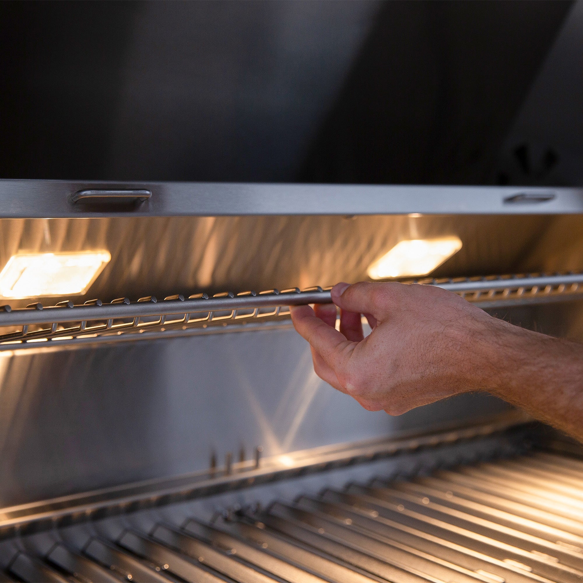 American Made Grills Encore 54-inch hybrid built-in grill — interior lighting over the grates