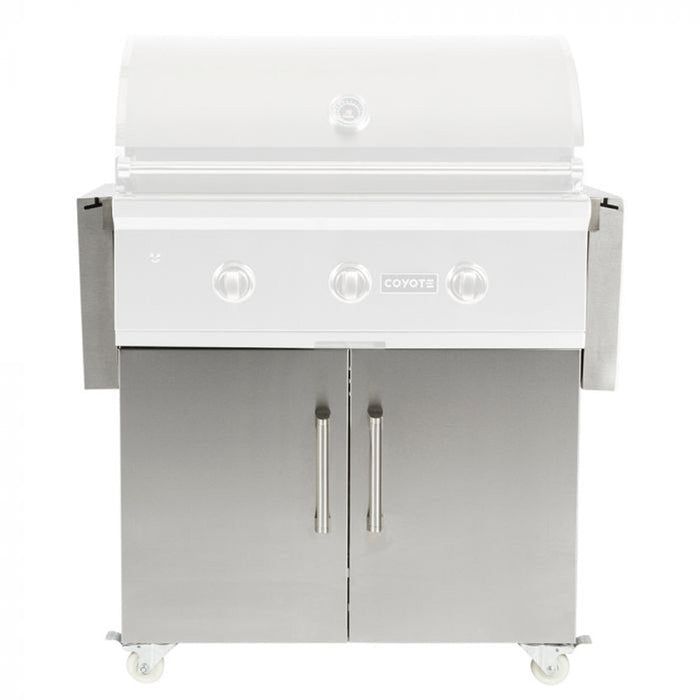 A stainless steel Coyote C-Series freestanding gas grill on a rolling cart with the hood closed, three control knobs and the Coyote logo on the front control panel, two cabinet doors below with tubular bar handles, and caster wheels, shown front-on against a white background