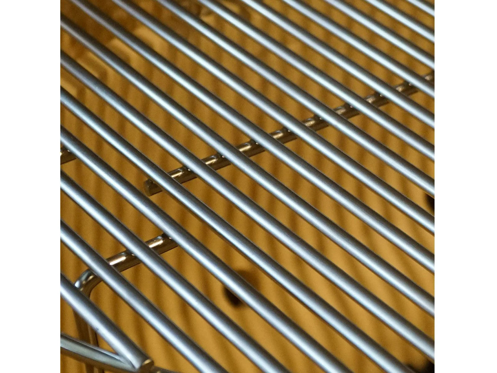 Close-up of the stainless steel cooking grate on the Primo Oval XX-Large ceramic charcoal grill head, PGCXXLH