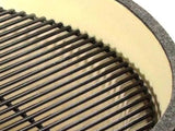 Stainless steel cooking grate seated in the ceramic firebox of the Primo Round ceramic charcoal grill head, PGCRH