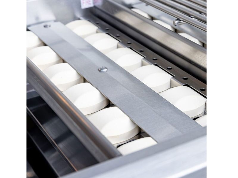 Close-up of a Summerset Sizzler Pro grill interior showing the ceramic radiant briquettes in their stainless steel trays