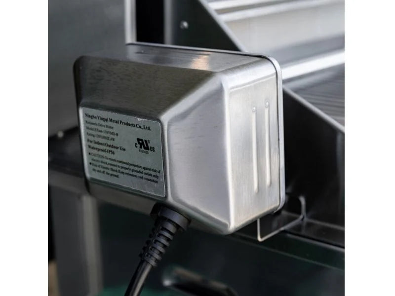 Stainless steel rotisserie motor with power cable mounted on the side of a Summerset TRL Pro built-in gas grill