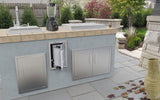 Close-up of the Sunstone Signature Series 17" Beveled Frame Swivel Paper Towel Holder highlighting the swivel-hinged door and durable construction, ideal for grilling spaces.