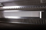 Inside view of the BONFIRE Prime 500 42" 5 Burner Built-In Grill featuring cast stainless steel burners and halogen interior lights, ideal for evening barbecues.