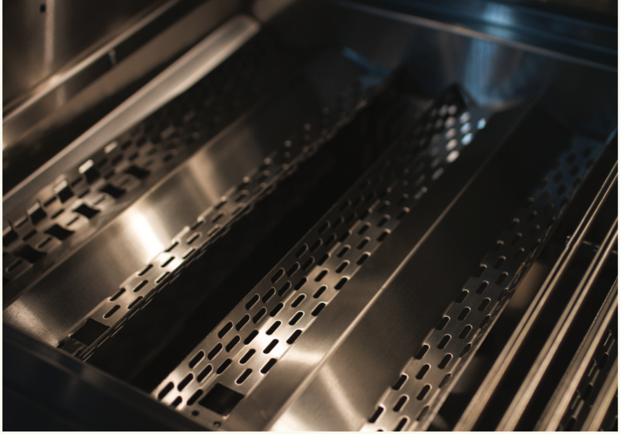 Close-up view of Bonfire Whistler 4 Drop-In Grill showing control panel and features for grilling.