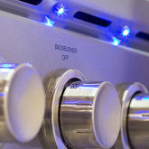 Side view of the Summerset TRLD 44" Built-in Grill highlighting the double-lined hood and LED controls for nighttime grilling.