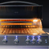 Summerset built-in gas grill with hood open showing a glowing infrared sear burner, red-hot grates and blue LED-lit control knobs on a black background