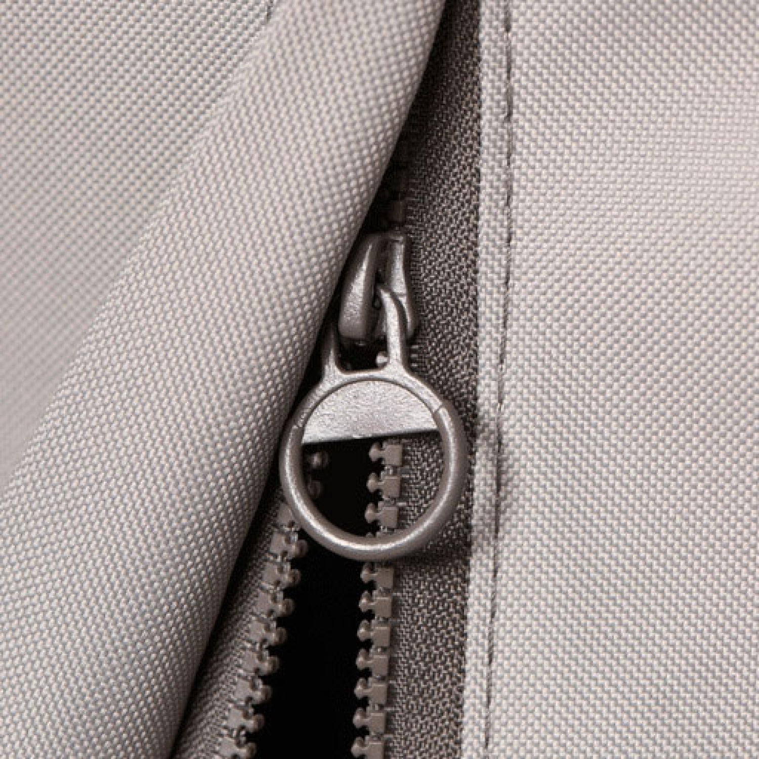 Zipper closure detail on gray Coyote grill cover fabric