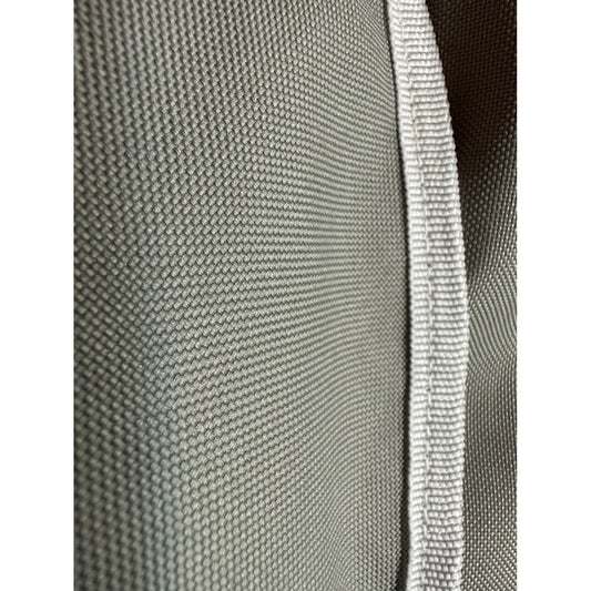 Textured gray fabric with white piping detail on Coyote grill cover