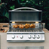 Summerset built-in gas grill with hood open roasting whole chickens on the rotisserie in an outdoor kitchen