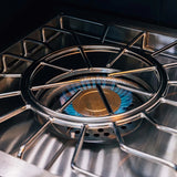 Atlas Power Burner inner ring lit with a blue simmer flame at 24,000 BTU