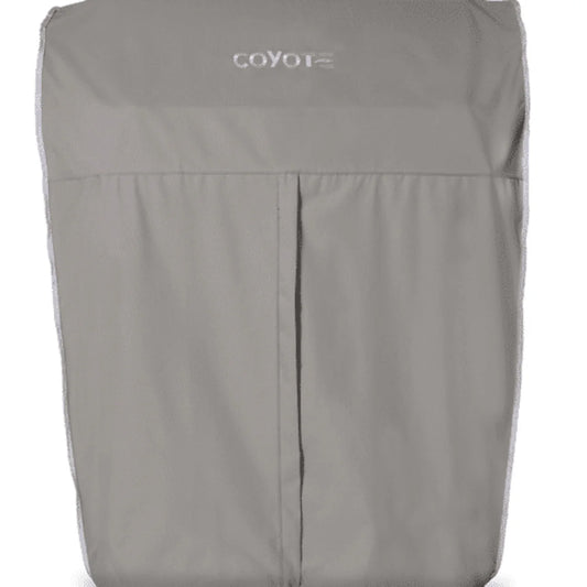A gray Coyote grill cover for a freestanding cart grill, with the Coyote logo printed across the top, shown on a white background