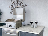 Le Griddle Wee GEE40 electric griddle cooking on its seasoned steel plate