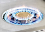 Alfresco 24-inch Versa Power cooker with both burners lit for full 65,000 BTU output around the brass center cap, AIPGVP