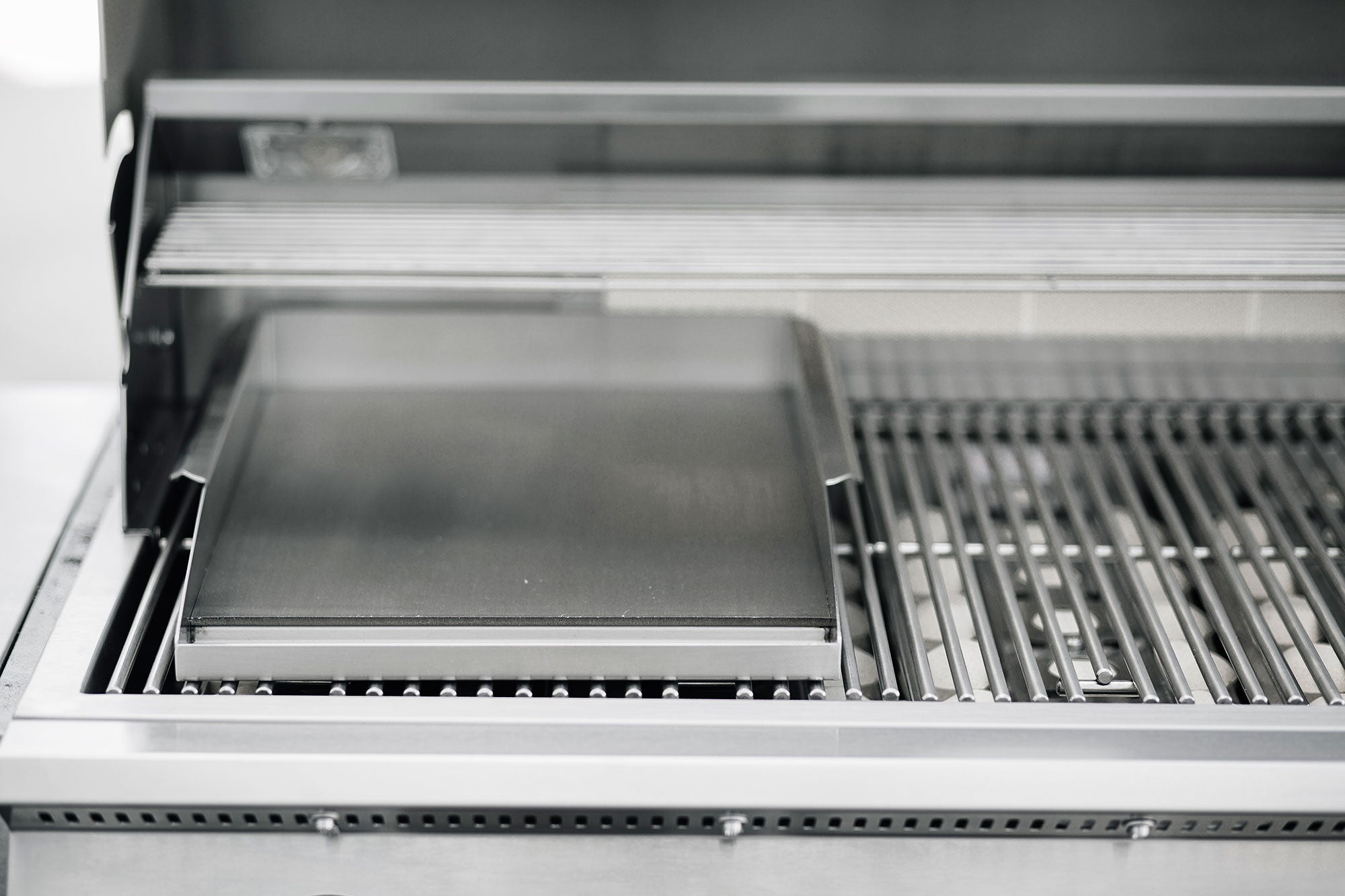 American Made Grills 14 x 17.5 inch stainless griddle plate — fitted over the cooking grate
