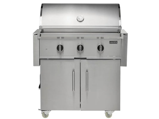 Coyote stainless steel gas grill with lid, three burners and storage doors on caster wheels