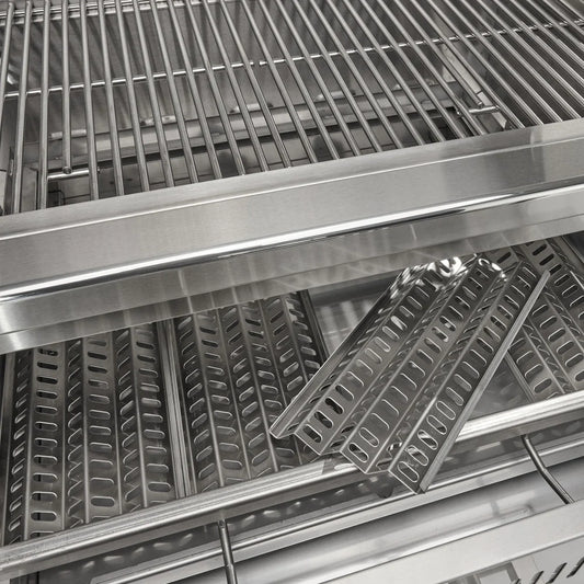 Stainless heat plates and cooking grates inside Coyote 36-inch charcoal grill