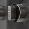 Close-up of a single stainless steel grill control knob on a grill control panel