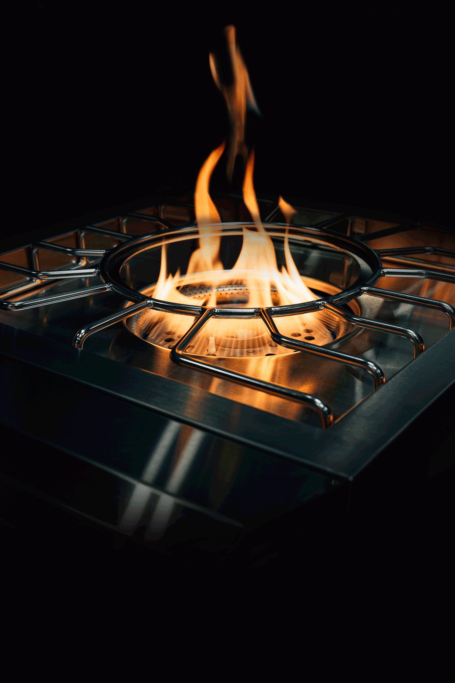 American Made Grills Encore power burner — burner lit at night