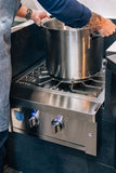American Made Grills Estate power burner — shown in an outdoor kitchen setting