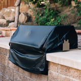 American Made Grills Alturi 30-inch built-in grill cover — fitted over a grill in an outdoor kitchen