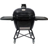 Primo Oval X-Large All-In-One ceramic charcoal grill on its heavy-duty stand with side shelves, PGCXLC
