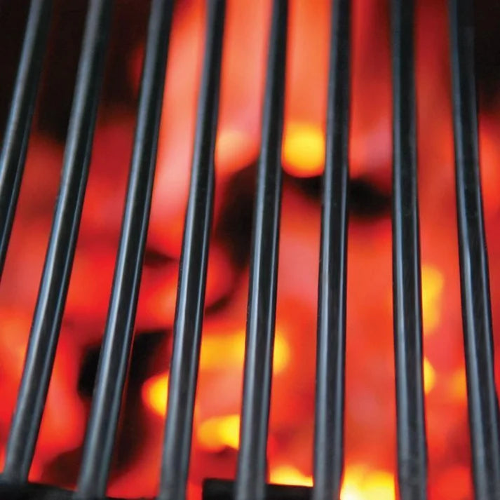 Cooking grates over glowing lump charcoal in the Primo Oval X-Large Jack Daniel's Edition ceramic charcoal grill, PGCXLHJ