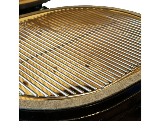 Stainless steel cooking grate seated in the ceramic firebox of the Primo Oval XX-Large ceramic charcoal grill head, PGCXXLH